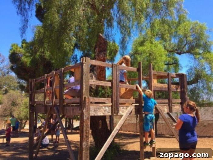 Surf City Adventure Playground 3 Children enjoying a break at a picnic table at Huntington Beach mud park