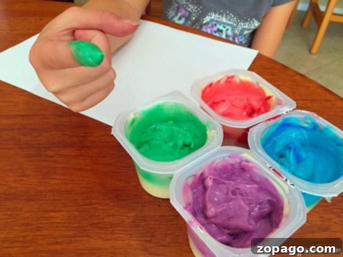 How to Make Edible Finger Paint: A fun and safe activity for toddlers Child enjoying edible finger paint activity