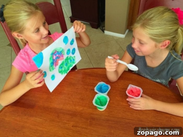 How to make edible fingerpaint: A fun and safe activity for toddlers Happy child making edible finger paint art