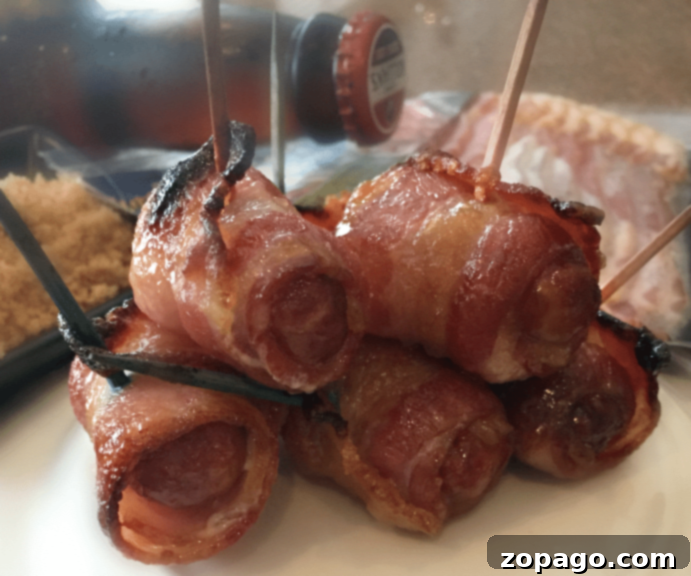 Football appetizer ideas, featuring crispy bacon-wrapped smokies glistening with a sweet glaze, presented on a platter for game day.