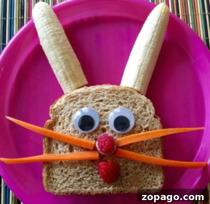 Cute Easter Bunny Sandwich A cute Easter bunny sandwich made with peanut butter, jelly, fruit, and carrot sticks, perfect for kids.
