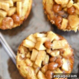 Tiny Temptation Apple Pies 3 A delightful display of three mini caramel apple pies, featuring diced apples and rich caramel, elegantly presented on a silver tray—perfect for those seeking a delectable recipe for mini apple pies.