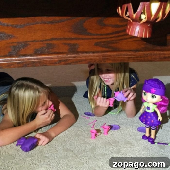 Little Charmers: Friendship's Magical Glow 5 Little Charmers doll and toys during playtime, showing children engaged in imaginative play