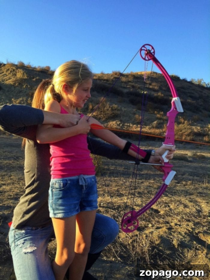 Targeting Family Fun 7 Archery for kids: A young archer focusing on her shot with Genesis