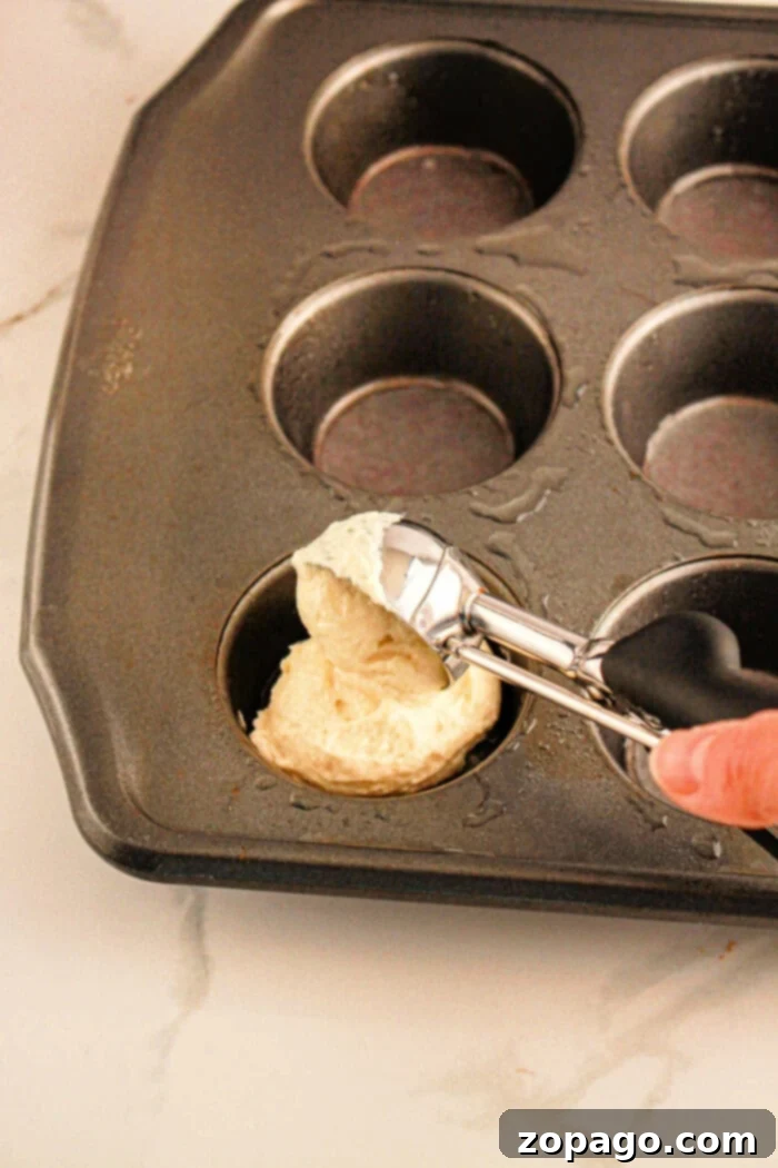 These muffin tin pineapple upside down cupcakes and really easy muffin tin desserts to make and the kids love them! Mini size cakes you can make using ingredients from the Dollar Store. If you love muffin tin recipes this is a fun one to try. #muffintin #dessert #pineappleupsidedown #cupcakes #cake img 23014 5