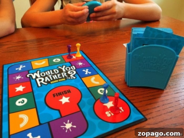 Hasbro Gaming Adventures 3 Family gathered around a table playing 'Would You Rather' board game.