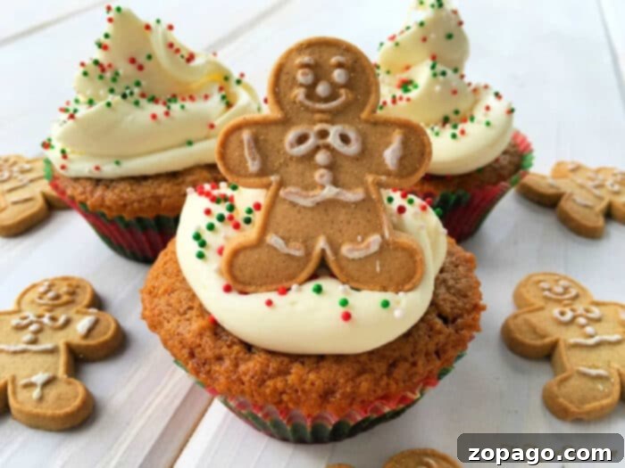 Starbucks Holiday Gingerbread Loaf 6 Cupcakes with white frosting, colorful sprinkles, and gingerbread man cookies on top, surrounded by more cookies—perfect alongside a slice of Starbucks gingerbread loaf.