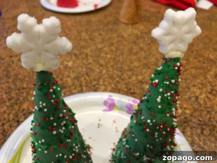 Close-up of a vibrant green sugar cone Christmas tree covered in festive sprinkles