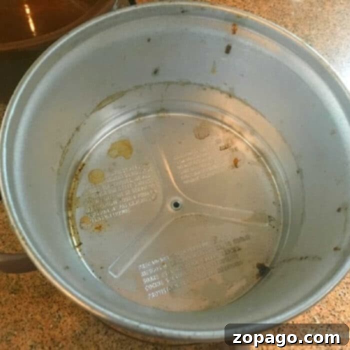Clean Your Slow Cooker Like a Pro 2 how to clean the metal part of a slow cooker - before cleaning with visible grime