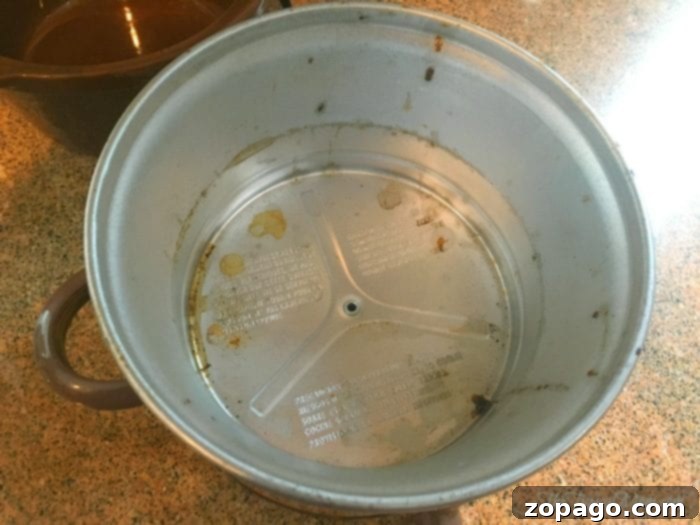 How to clean your crockpot, the inside of your crockpot, with just a few household items! If you haven't done this before it's probably disgusting! #crockpot #cleaning #house #slowcooker How to clean the inside of your slow cooker - close up of baked on food