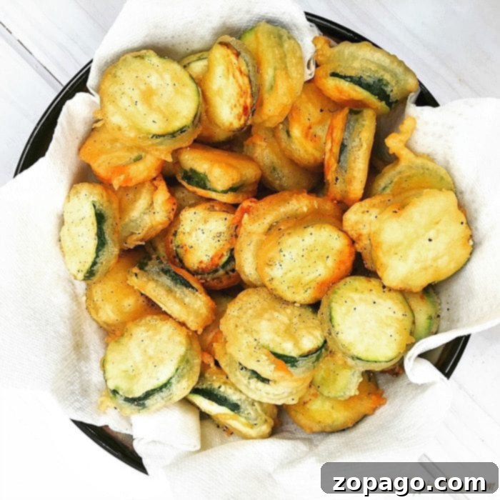 Crispy fried zucchini, a delicious and easy-to-make side dish. A close-up of perfectly golden and crispy fried zucchini, ready to be enjoyed.
