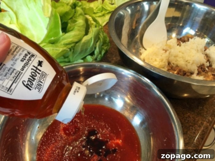 Comforting Slow Cooker Cabbage Rolls 5 Placing meat and rice filling on a cabbage leaf