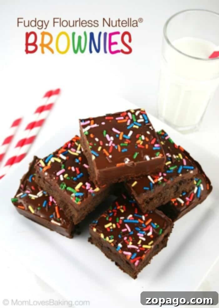 Close-up of decadent gluten-free brownies with a rich, fudgy texture, sprinkled with powdered sugar.
