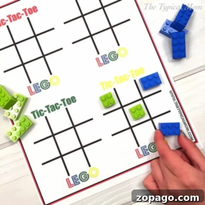 LEGO Tic Tac Toe: Fun for LEGO Birthday Parties and Rainy Days Kids playing Tic Tac Toe with LEGO bricks on a free printable board, perfect for a LEGO themed birthday party or indoor fun.