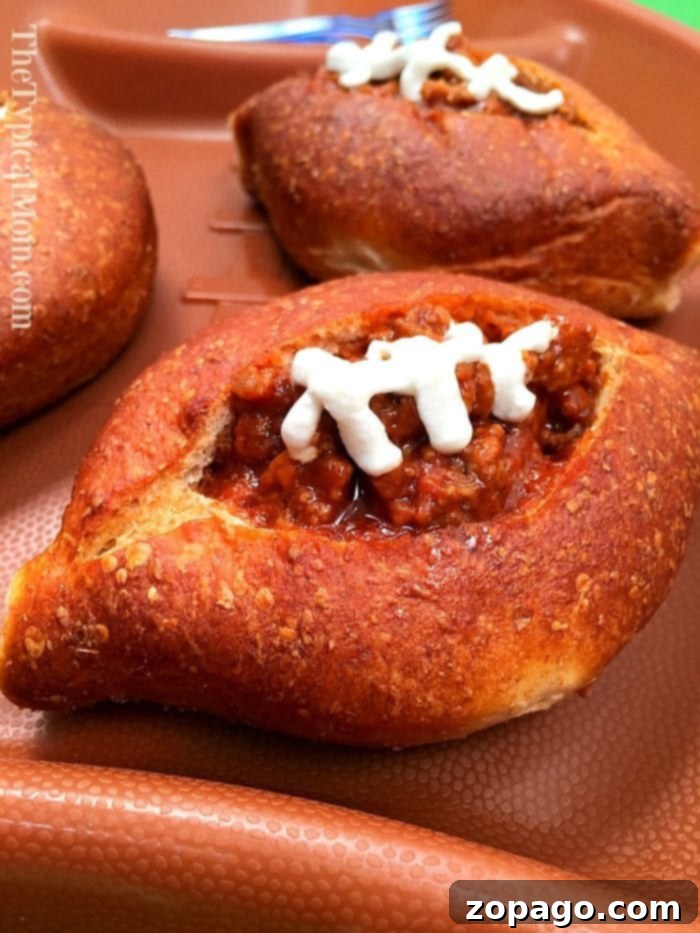 Sloppy Joe bread bowls are great for a football appetizer or any other party you're having! EASY to make and delicious! #football #sloppyjoes #superbowl #appetizer #breadbowls Sloppy Joe Bread Bowls - perfect football appetizers
