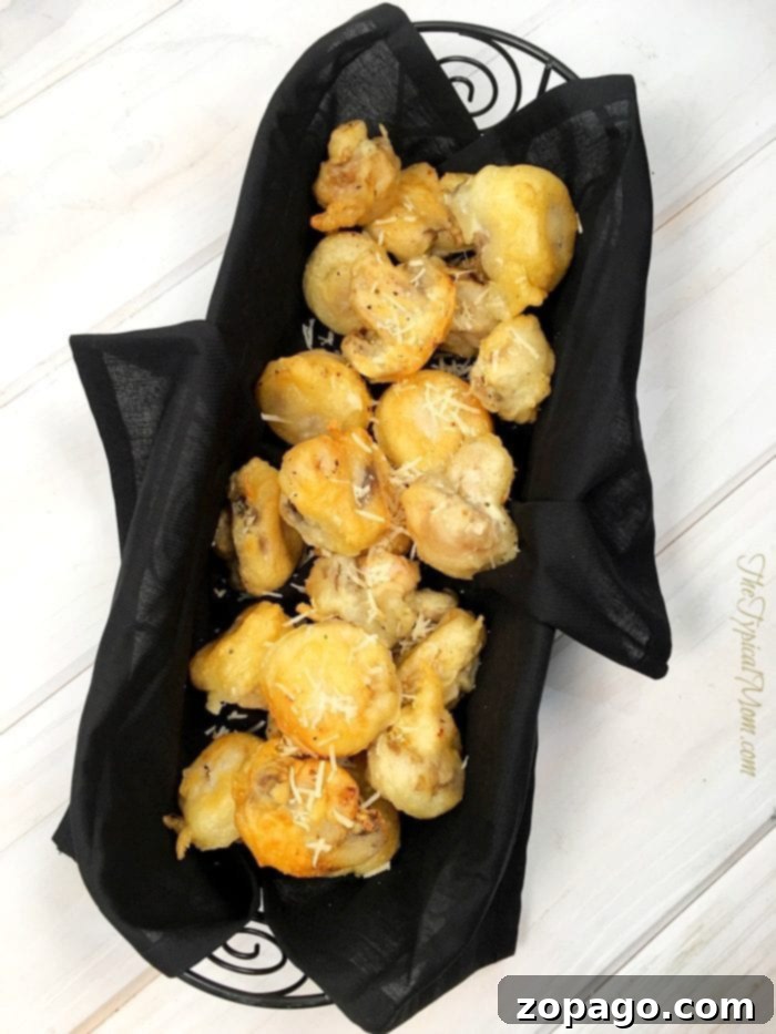 These parmesan rosemary mushrooms are such a great vegetable side dish or appetizer that even my kids love and they're easy to make! Parmesan rosemary tempura mushrooms served as an elegant appetizer
