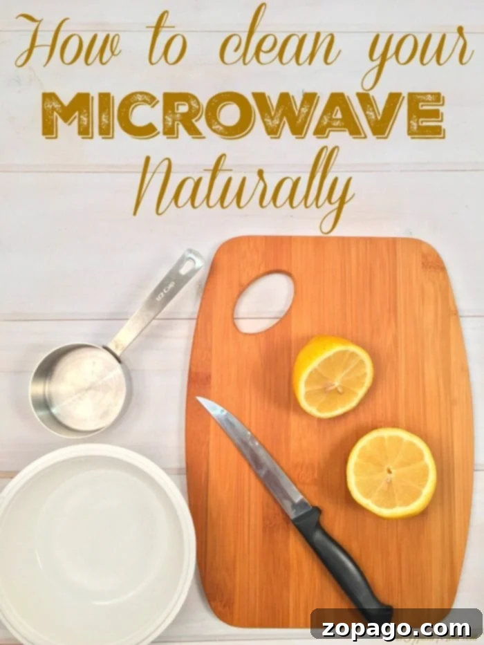 Learn how to effortlessly clean your microwave naturally using just lemons and water, making grime wipe away with ease. Microwave being cleaned naturally with a lemon and water mixture for easy grime removal