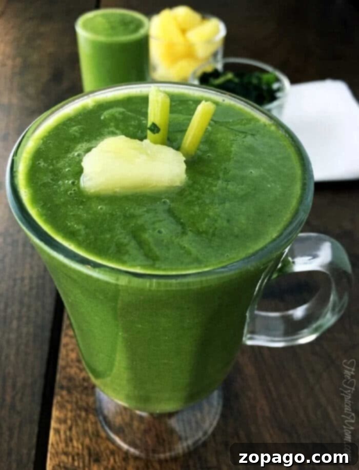 Best Green Superfood Smoothie Recipe with Pineapple, Spinach, and Kale Delicious and healthy green smoothie with pineapple chunks, spinach, and kale