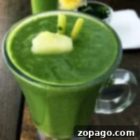 Superfood green smoothie with pineapple in a glass