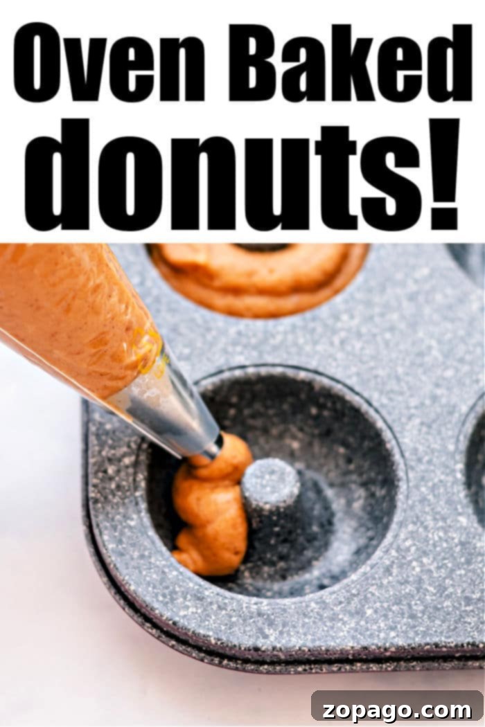 Pumpkin Spice Baked Donuts 5 A plate of freshly baked pumpkin donuts, artfully glazed and ready to be enjoyed, highlighting the delicious baked pumpkin donut recipe.