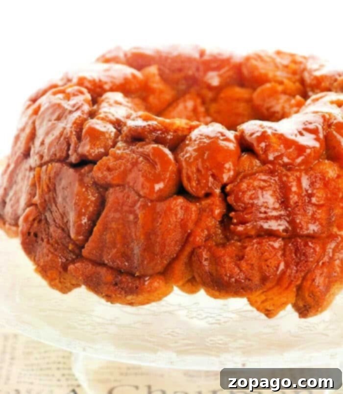 Effortless Monkey Bread 2 Delicious monkey bread made with refrigerated biscuits, golden brown and glistening with glaze.