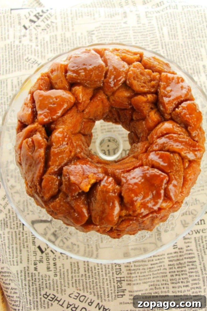 Easy monkey bread recipe using refrigerated biscuits is easier than you think! Add apples, berries and a drizzle of frosting for the ultimate breakfast. #monkeybread #biscuit #pillsbury #christmasbreakfast #breakfast #brunch #dessert #easy #basic #thetypicalmom Another view of the easy monkey bread, highlighting its golden crust and inviting texture.