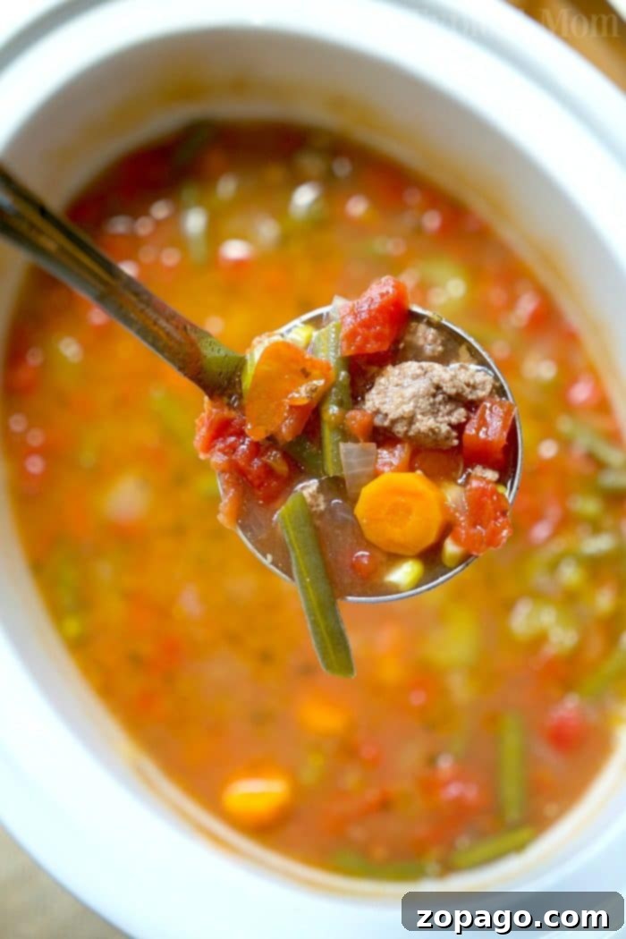 Crock pot vegetable beef soup recipe that's healthy and full of flavor. Large bowl of homemade Crock Pot Vegetable Beef Soup