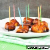 Pineapple Bacon Bliss 4 Close-up of a serving of crispy bacon-wrapped pineapple bites on a plate.