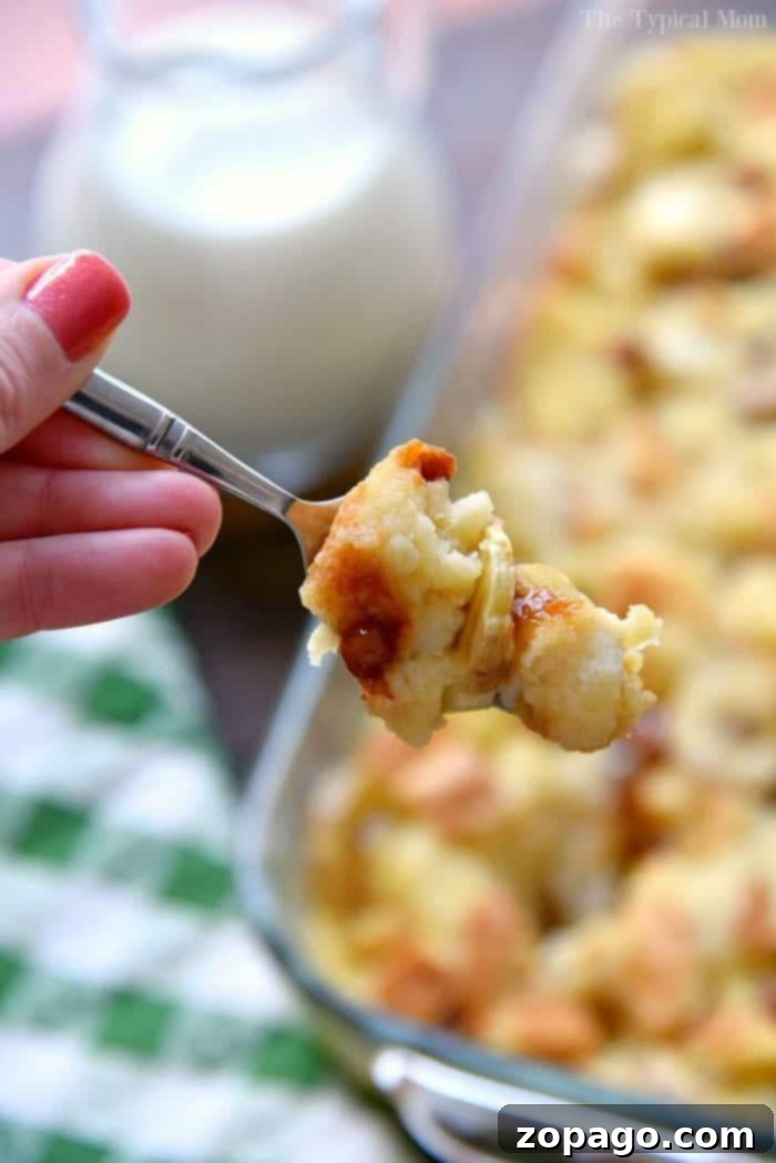 Melt-in-Your-Mouth Banana Bread Pudding 3 A slice of delicious bread pudding with bananas, served warm.