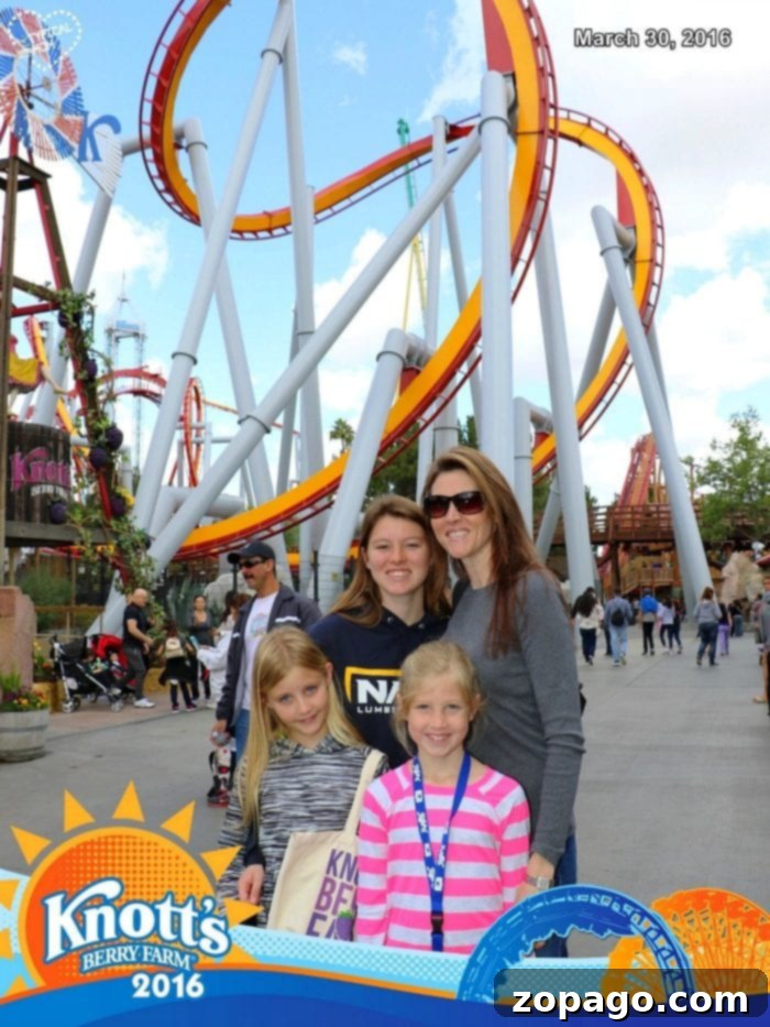 Knott's Berry Farm Photo Memories 6 A family of four captured in a Knott's Berry Farm FunPix moment, posing with smiles and excitement in front of a roller coaster, dated March 30, 2016, showcasing lasting family memories.