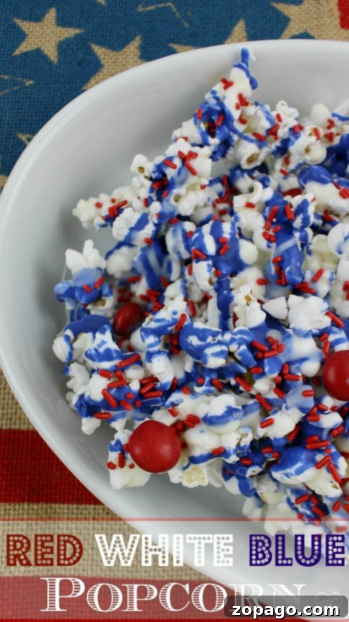 Red, White, and Blue Popcorn recipe is a perfect Memorial Day side dish or 4th of July dessert too. Chocolate popcorn with patriotic colors. Fourth of July dessert