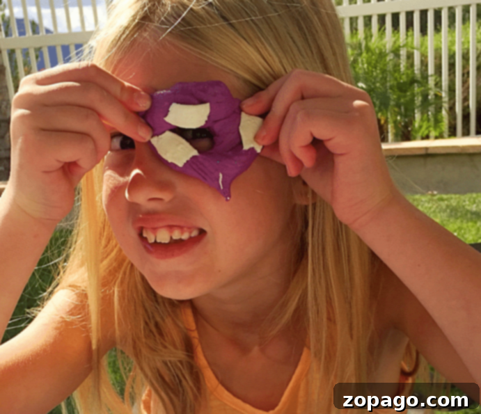 Easy 2 ingredient edible playdough that your kids will love! A simple playdoh recipe that is perfect for young children and fun to play with, even toddlers. #edible #playdough #playdoh #dough #craft #activity #rainyday #preschool #kindergarten #frosting Edible playdough in various colors being shaped by hands, demonstrating its moldability and fun.