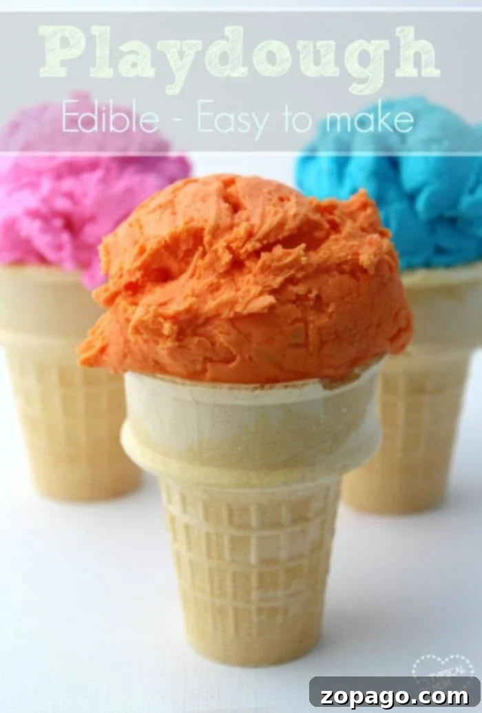 2 ingredient edible playdough that your kids will love! A simple playdoh recipe that is perfect for young children and fun to play with, even toddlers. #edible #playdough #playdoh #dough #craft #activity #rainyday #preschool #kindergarten #frosting A child's hands playing with vibrant, colorful edible playdough, showcasing the fun and safe activity.