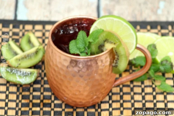 A stylish Moscow Mule mug filled with a refreshing drink.