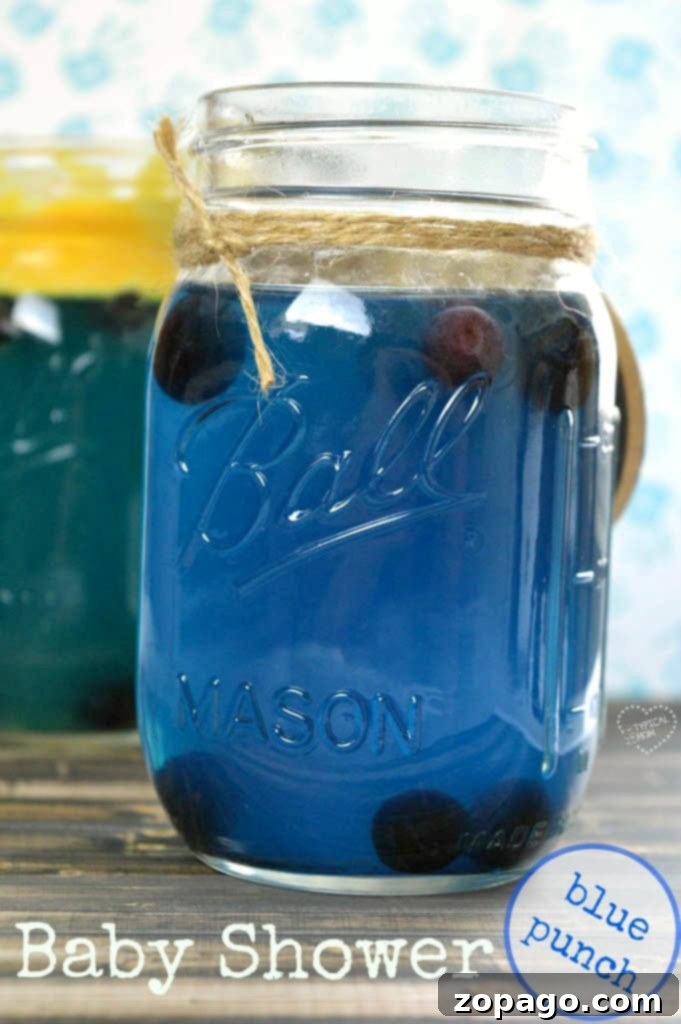 Various blue baby shower drinks and decorations, including punch and cupcakes.
