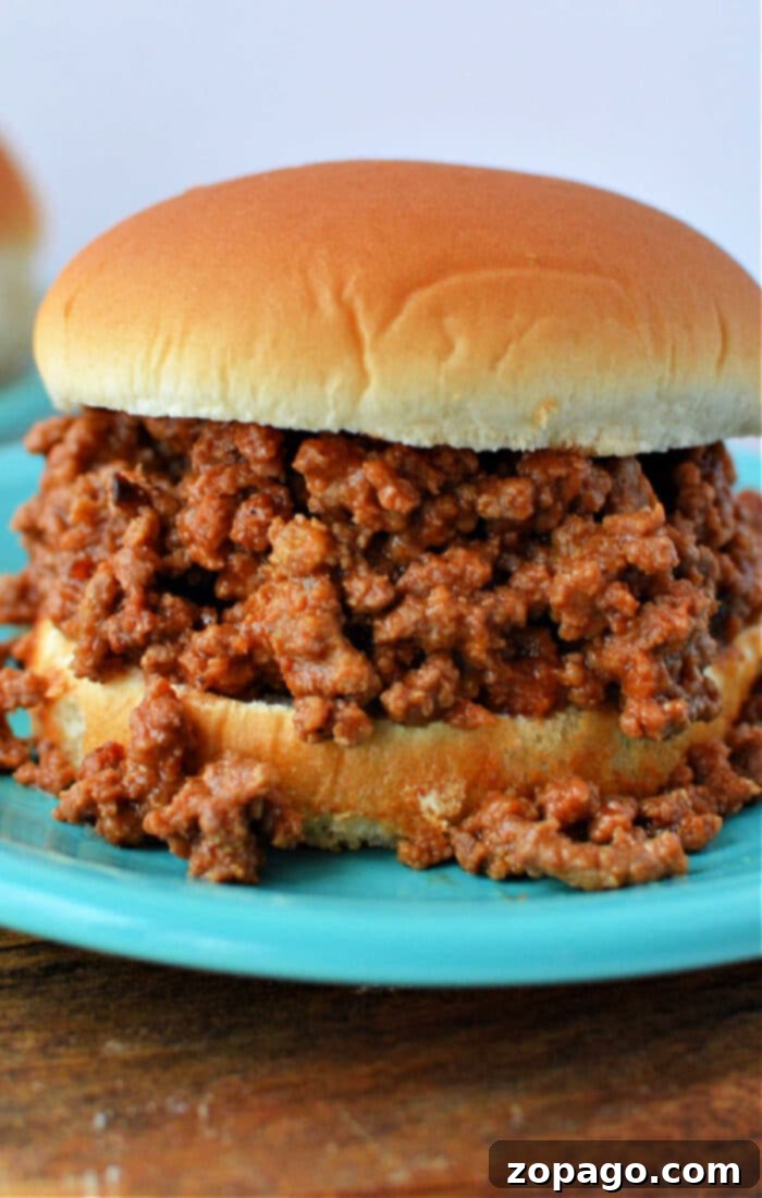 Simple Campfire Feasts for Families 5 Four-ingredient slow cooker sloppy joes, a perfect recipe adaptable for easy camping meals, served on buns.