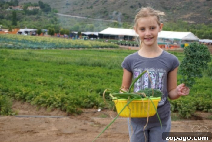 Tanaka Farms Irvine Experience 2 Children happily picking fresh vegetables like carrots and green beans at Tanaka Farms Irvine during a farm tour