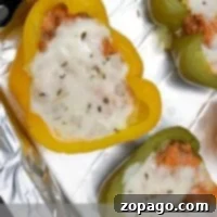 Lasagna stuffed bell peppers brimming with savory lasagna filling and crowned with melted cheese.