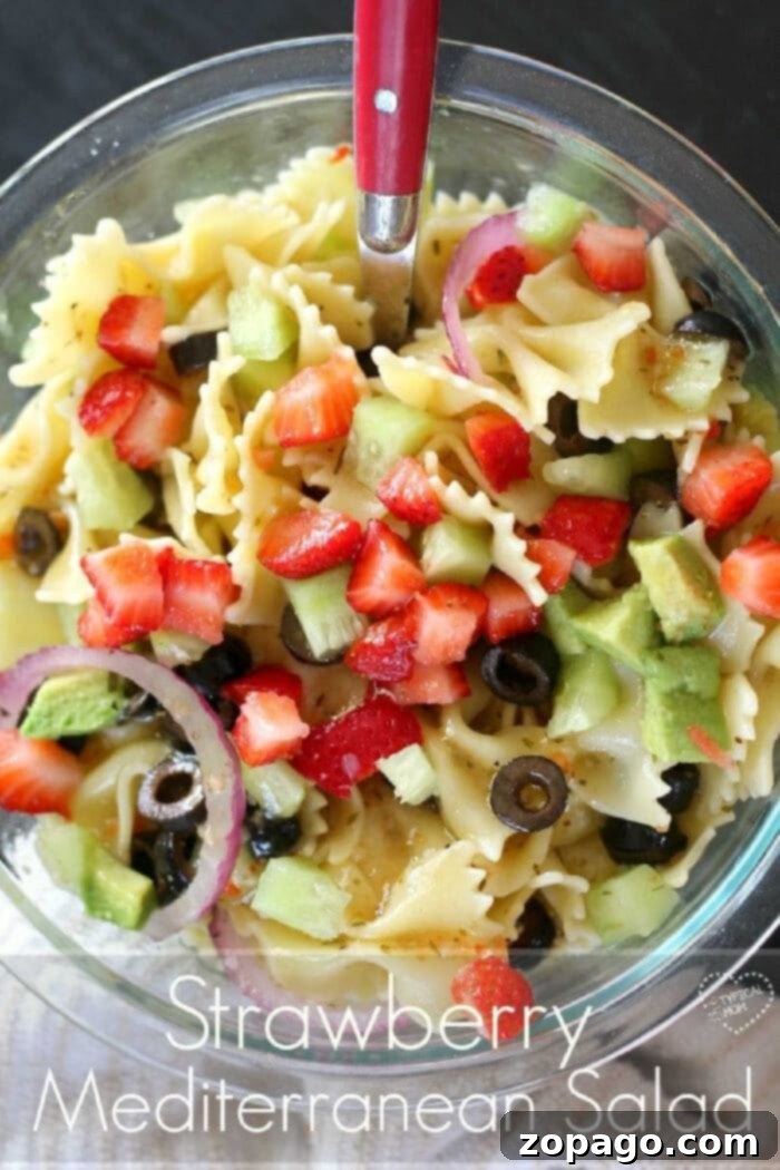 This is an easy and delicious Mediterranean pasta salad recipe to make as a side dish for a barbecue or a healthy lunch option with clean Greek flavors. You've gotta try this strawberry Mediterranean pasta salad recipe. Great side dish!