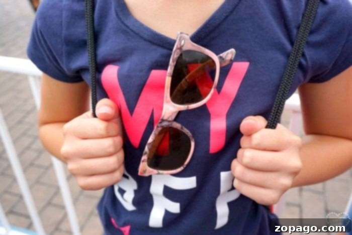 A comprehensive guide to Disneyland tips for families, covering everything from packing essentials to character meet-and-greets. Disneyland tips: Family wearing hats and sunglasses for sun protection.