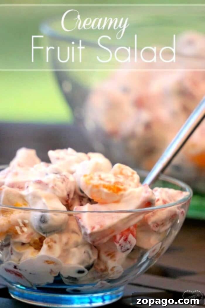 Easy fruit salad recipe that's super creamy and easy to make.. The perfect BBQ side dish or a light fruit dessert idea that everyone will love! fruit salad with cool whip