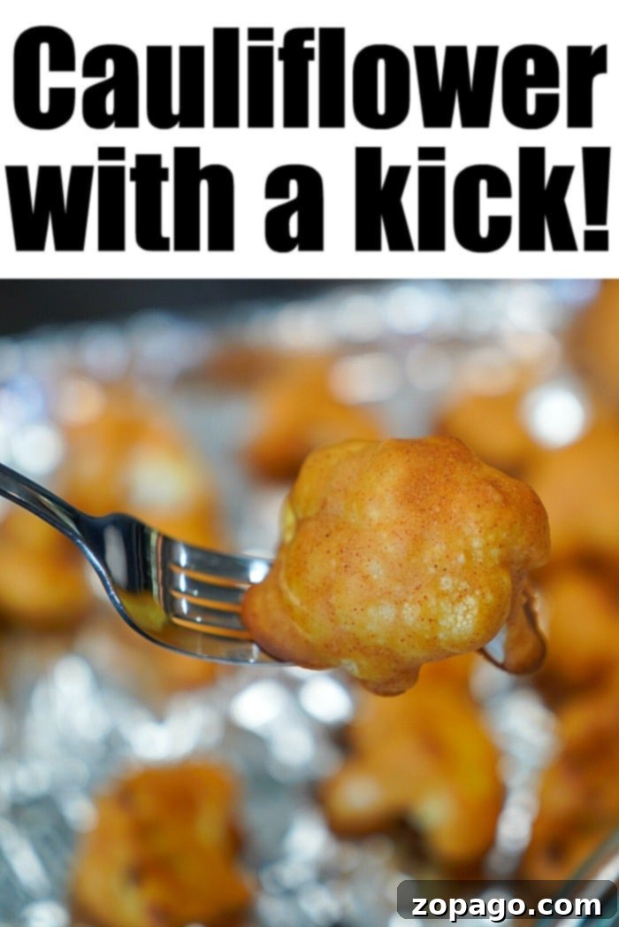 Delicious Baked Buffalo Cauliflower Side Dish Close-up of baked buffalo cauliflower florets, glistening with hot sauce, ready to be served as a flavorful side or snack.