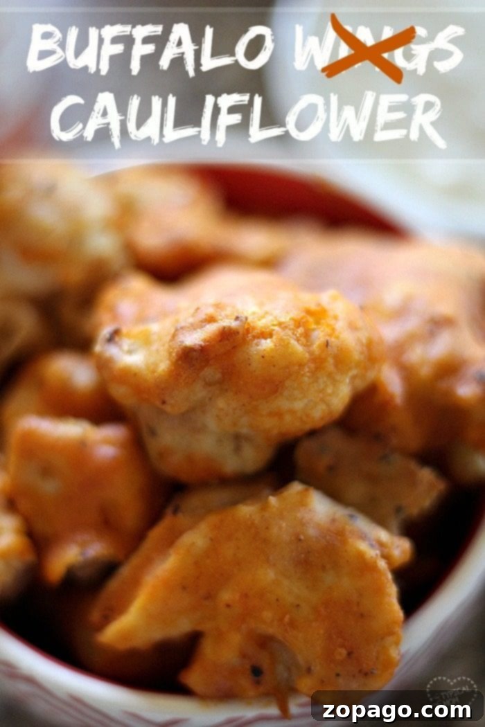 Savory Buffalo Cauliflower Bites Close-up of buffalo baked cauliflower, perfectly coated in spicy sauce, served in a rustic bowl.