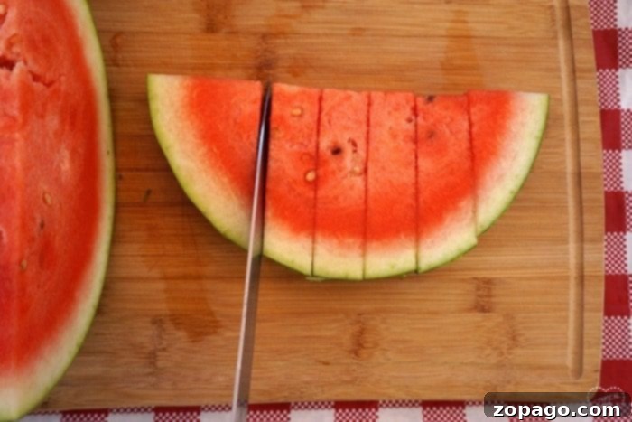 Master Watermelon Slicing with Ease 4 Watermelon slices arranged beautifully on a plate