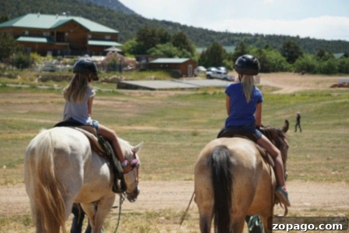 Zion Ponderosa Ranch Resort in Utah is the best family vacation we've ever taken! A great family vacation destination that we have been to twice because we love it so much. Lots of activities, hiking, zip lining and breakfast is included when you stay in their log cabins. Amazing hidden gem outside Zion National Park. #zion #nationalpark #family #vacations #utah #familytravel #thetypicalmom #travelblogger Horseback Riding Fun at Zion Ponderosa Ranch Resort