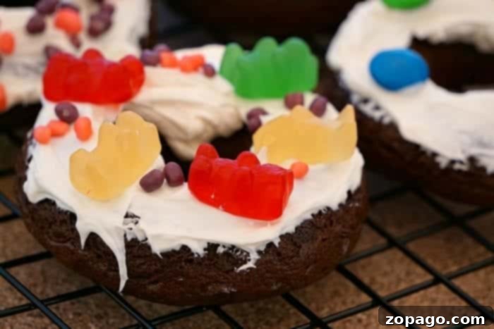 Cake mix donuts are so easy to make using any flavor of boxed cake mix you want! It's an easy baking project with your kids. #cakemix #donuts #doughnuts #dessert #bakingwithkids #dessert #breakfast Step-by-step image showcasing how to make delicious baked doughnuts using cake mix, a perfect activity for home bakers.