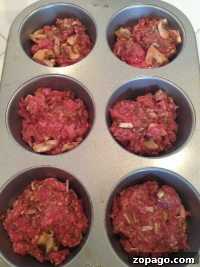 Mini Meatloaf Muffins 4 Muffin tin meatloaf ready to be baked or served.
