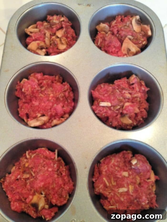 Meatloaf Minis 6 A muffin tin filled with freshly baked, individual meatloaf portions, presented as a delicious and convenient meal option.