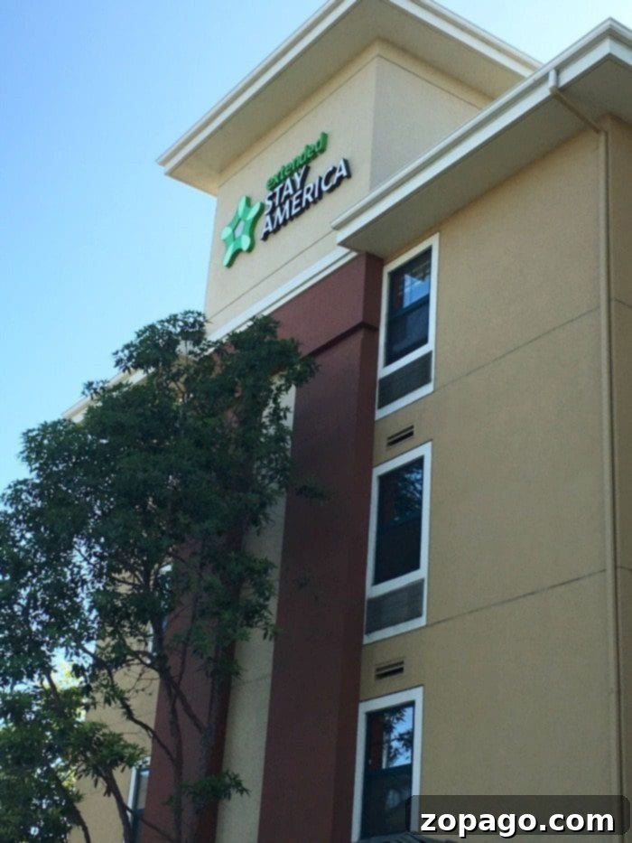 Extended Stay America review of why it's a great hotel for families and long stays. Hotel includes a kitchen and amenities. Extended Stay America hotel room with kitchen area, ideal for families and long stays