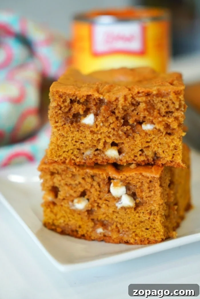 Chewy Pumpkin Blondies from Cake Mix Delicious cake mix pumpkin blondies, a simple and chewy fall dessert.
